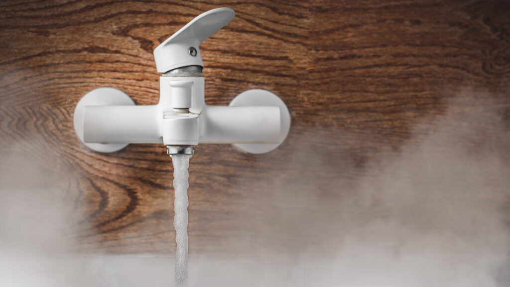 Lower CO2 emissions to limit global warming and climate change. Concept with manager hand turning knob to reduce levels of CO2. New technology to decarbonize industry, energy and transport